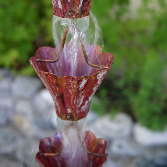Aged Star Flower Cups aged copper Rain Chain with water flowing through cup