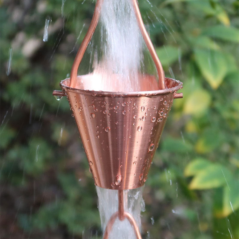 Copper colored Steel Cups Rain Chain with water running through cups
